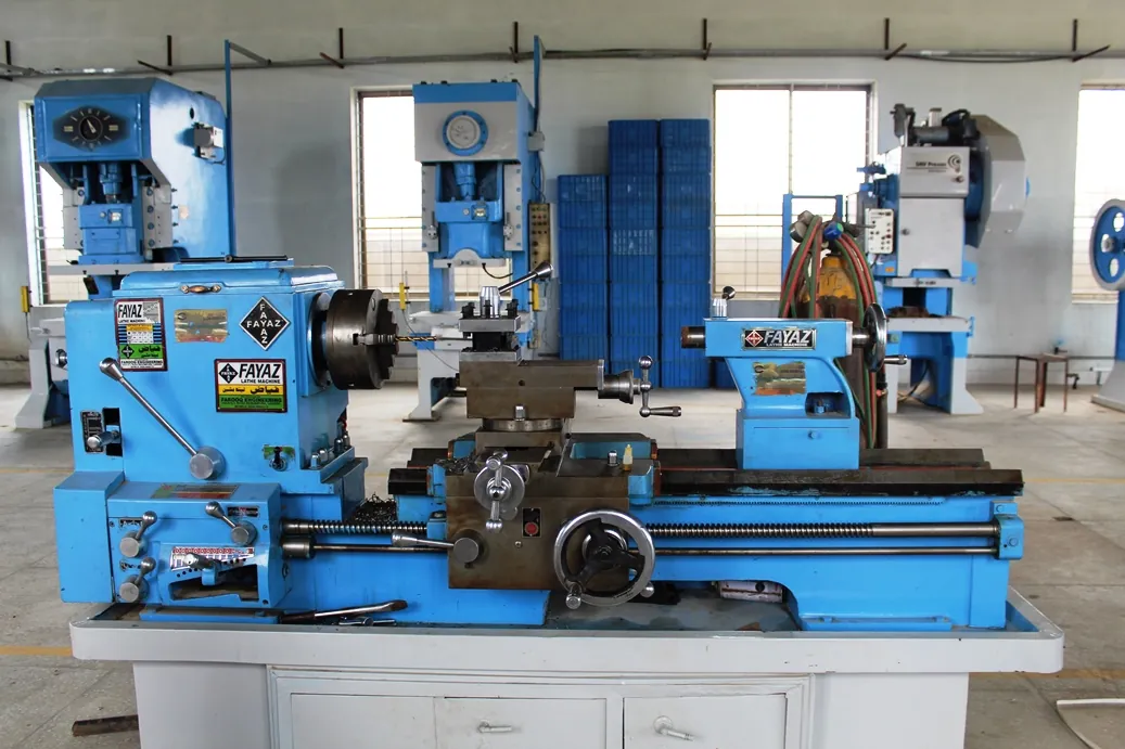 Tool room lathe with mechanical presses behind it at Stellar MPM