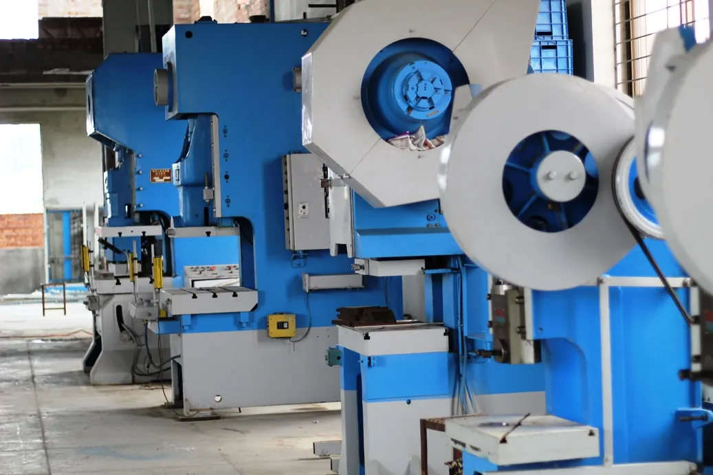 Close view of mechanical press flywheels in the Stellar MPM press line